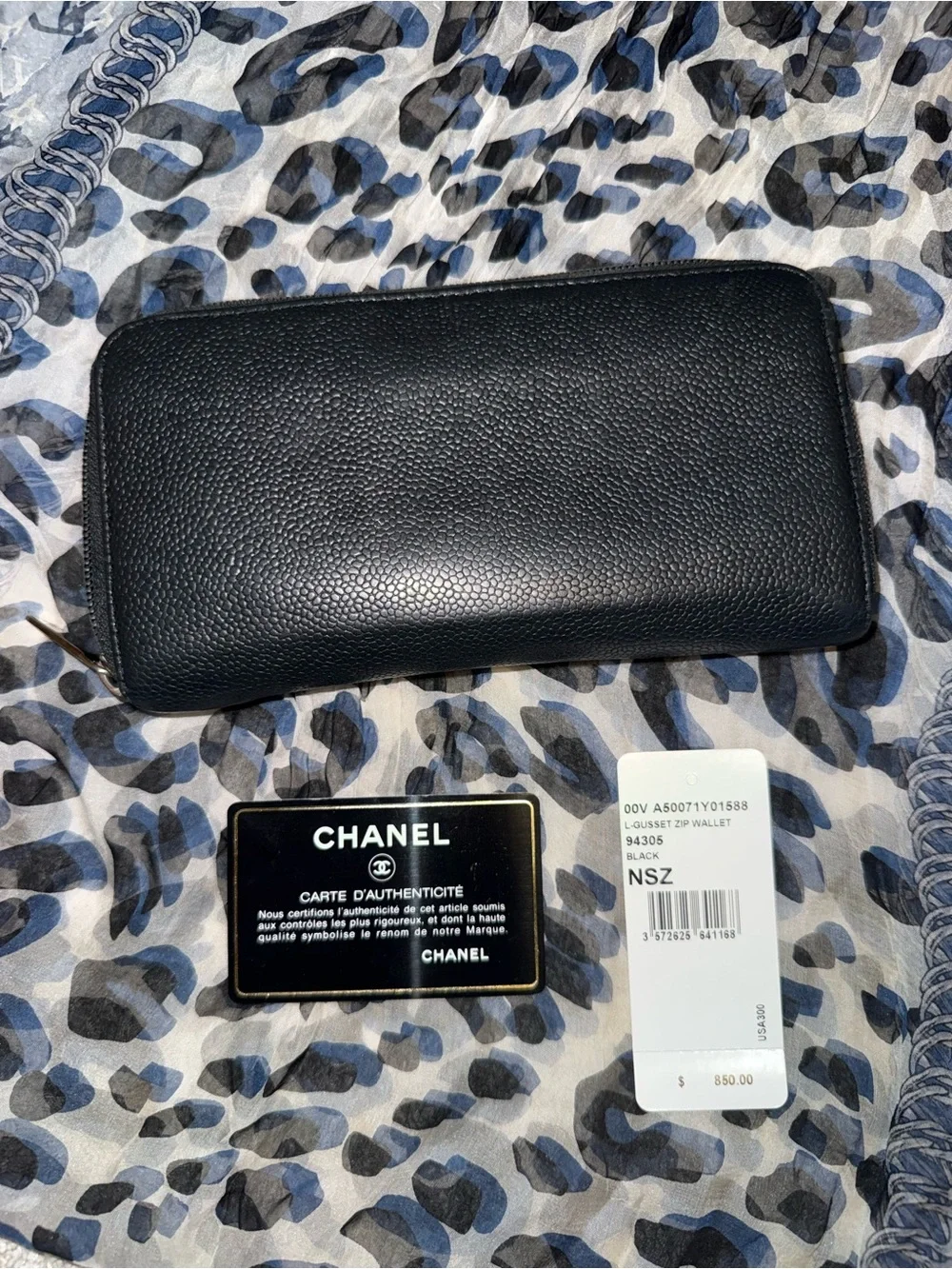 Authentic CHANEL Black Caviar Leather Zip-Around Wallet with Embossed CC